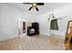 Eat-in kitchen with black appliances, tile flooring, and access to the laundry room at 1008 Valley St, Kannapolis, NC 28081