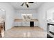 Spacious kitchen with white cabinets, ceramic tile flooring, and modern appliances at 1008 Valley St, Kannapolis, NC 28081