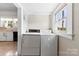 Bright laundry room with window and washer-dryer hookups at 1008 Valley St, Kannapolis, NC 28081
