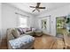 Comfortable living room features hardwood floors, large sectional sofa, and a ceiling fan at 1008 Valley St, Kannapolis, NC 28081