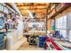 Workshop area in basement with tools, shelving, and visible ceiling ducts at 10127 Tallent Ln, Huntersville, NC 28078