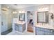 Elegant bathroom featuring dual vanities, a glass-enclosed shower, and sleek finishes at 10127 Tallent Ln, Huntersville, NC 28078