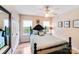Comfortable bedroom with dark wood bed, muted green bedding and natural light at 10127 Tallent Ln, Huntersville, NC 28078