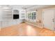 Inviting bonus room featuring built-in shelving, window seat and lots of natural light at 10127 Tallent Ln, Huntersville, NC 28078