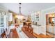 Bright dining area with chandelier and seamless flow into the modern kitchen space at 10127 Tallent Ln, Huntersville, NC 28078