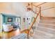 Open foyer featuring wood floors and staircase, with views into sitting room at 10127 Tallent Ln, Huntersville, NC 28078