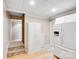 Spacious kitchen features white appliances and cabinets and light wood floors at 10127 Tallent Ln, Huntersville, NC 28078