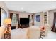 Relaxing living room with recliner seating, large TV, and custom shelving at 10127 Tallent Ln, Huntersville, NC 28078