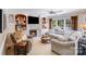 Inviting living room with fireplace, built-ins, and large windows offering natural light at 10127 Tallent Ln, Huntersville, NC 28078
