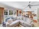Spacious living room with large sectional sofa, and view to deck and dining area at 10127 Tallent Ln, Huntersville, NC 28078