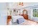Serene main bedroom with tray ceilings, wood floors, natural light, and elegant furnishings at 10127 Tallent Ln, Huntersville, NC 28078