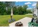 Expansive backyard featuring lush green grass and a tree-lined view at 10410 Bradstreet Commons Way, Charlotte, NC 28215