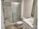 Clean bathroom features a walk-in shower with glass doors, a white vanity, and updated fixtures at 10410 Bradstreet Commons Way, Charlotte, NC 28215