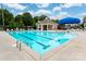 Community pool with lounge area and covered picnic space available at 10410 Bradstreet Commons Way, Charlotte, NC 28215