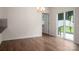 Bright dining room featuring a sliding glass door and wood floors at 10410 Bradstreet Commons Way, Charlotte, NC 28215
