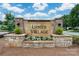 Lanier Village community entrance sign featuring stonework and landscaping at 10410 Bradstreet Commons Way, Charlotte, NC 28215