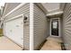 This charming home features a covered entryway and a spacious two-car garage at 10410 Bradstreet Commons Way, Charlotte, NC 28215