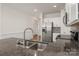 Granite counters and stainless appliances highlight this updated kitchen at 10410 Bradstreet Commons Way, Charlotte, NC 28215