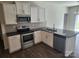Modern kitchen boasts stainless steel appliances, granite countertops, and ample cabinet space at 10410 Bradstreet Commons Way, Charlotte, NC 28215
