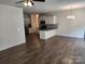 Bright, open-concept kitchen and dining area with stainless steel appliances and hardwood floors at 10410 Bradstreet Commons Way, Charlotte, NC 28215
