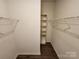 Organized walk-in closet with shelves and ample storage space at 10410 Bradstreet Commons Way, Charlotte, NC 28215