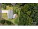 Aerial view of a house featuring a large lot surrounded by trees, with a deck and hot tub at 108 Shade Tree Cir, Fort Mill, SC 29715