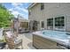 Backyard deck with hot tub, seating and patio furniture for relaxing and outdoor entertainment at 108 Shade Tree Cir, Fort Mill, SC 29715