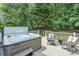 Outdoor deck featuring a hot tub with lounge seating, offering a private and relaxing retreat at 108 Shade Tree Cir, Fort Mill, SC 29715