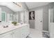 Bright bathroom offers dual sinks, large mirror, a walk-in shower, and natural light at 108 Shade Tree Cir, Fort Mill, SC 29715