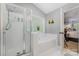 Bathroom showcases shower, soaking tub, and natural light from a frosted window at 108 Shade Tree Cir, Fort Mill, SC 29715
