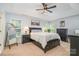 Comfortable bedroom features a ceiling fan, neutral walls, and plenty of natural light at 108 Shade Tree Cir, Fort Mill, SC 29715