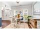 Dining room featuring hardwood floors, wainscoting, a modern chandelier, and sailboat decor at 108 Shade Tree Cir, Fort Mill, SC 29715