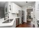 Modern kitchen boasts stainless steel appliances, quartz countertops, and subway tile backsplash at 108 Shade Tree Cir, Fort Mill, SC 29715