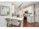 Modern kitchen featuring white cabinets, stainless steel appliances, and counter seating at 108 Shade Tree Cir, Fort Mill, SC 29715