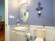Updated bathroom features granite countertop, white vanity, and framed mirror at 11120 Sevilla Ct, Charlotte, NC 28226