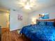 Comfortable bedroom with hardwood floors, ceiling fan, and two-door closet at 11120 Sevilla Ct, Charlotte, NC 28226