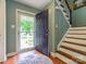 Welcoming foyer showcasing hardwood floors and an open staircase to the upper level at 11120 Sevilla Ct, Charlotte, NC 28226