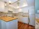 Well-lit kitchen with ample cabinet space, a breakfast bar, and modern appliances at 11120 Sevilla Ct, Charlotte, NC 28226