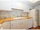 Functional kitchen features white cabinetry, wood countertops, and stainless steel dishwasher at 11120 Sevilla Ct, Charlotte, NC 28226