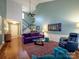 Inviting living room with a fireplace, staircase access, and a view into the entry area at 11120 Sevilla Ct, Charlotte, NC 28226