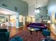 Open-concept living room flows into the dining area and features a grand staircase at 11120 Sevilla Ct, Charlotte, NC 28226