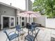 Outdoor patio area with seating, an umbrella, and a grill, perfect for entertaining and outdoor dining at 11120 Sevilla Ct, Charlotte, NC 28226