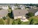 Aerial view of the home with a patio, landscaped yard, and neighboring houses showcases its location at 112 E Neel Ranch Rd, Mooresville, NC 28115