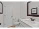Clean bathroom featuring toilet, sink, mirror, and white paint at 112 E Neel Ranch Rd, Mooresville, NC 28115