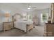 Comfortable bedroom with a large bed, soft lighting, and neutral decor at 112 E Neel Ranch Rd, Mooresville, NC 28115
