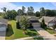 A single-Gathering home featuring a stone facade, manicured lawn, and a convenient two-car garage at 112 E Neel Ranch Rd, Mooresville, NC 28115