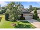 Charming home with a well-maintained lawn, tree, and a two-car garage, enhancing its curb appeal at 112 E Neel Ranch Rd, Mooresville, NC 28115