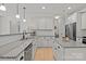 Spacious kitchen featuring granite countertops, stainless appliances, white cabinets, and a functional island at 112 E Neel Ranch Rd, Mooresville, NC 28115