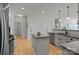 Charming kitchen with island and stainless appliances, offering ample space for culinary endeavors at 112 E Neel Ranch Rd, Mooresville, NC 28115