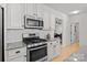 Contemporary kitchen equipped with stainless steel appliances and ample cabinet space at 112 E Neel Ranch Rd, Mooresville, NC 28115
